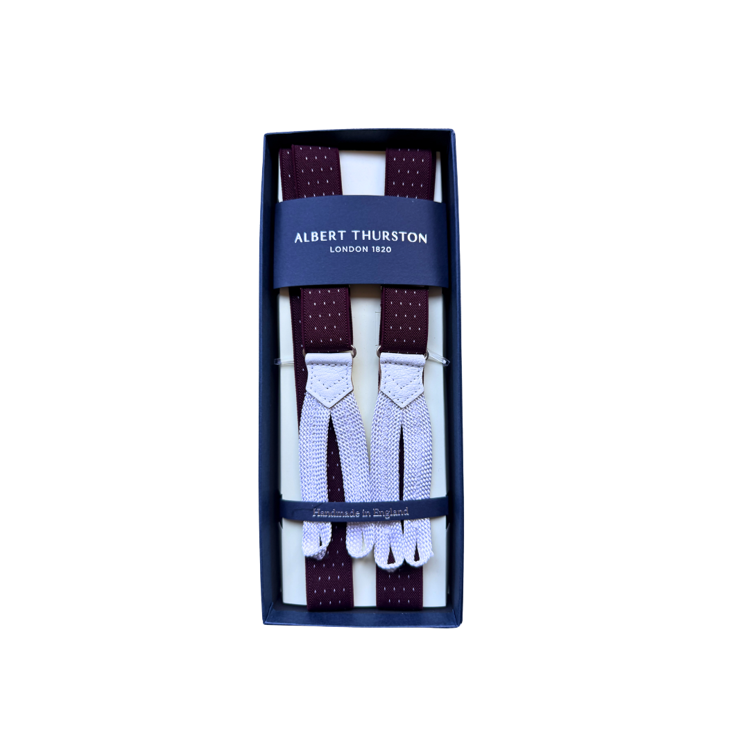 Burgundy spot braces with white braided button ends in presentation box.